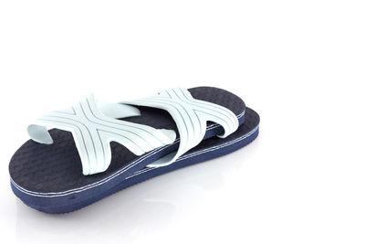 Close-up of shoes over white background