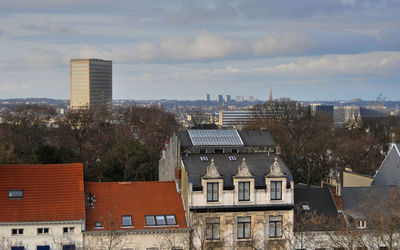 High angle view of buildings in city against sky