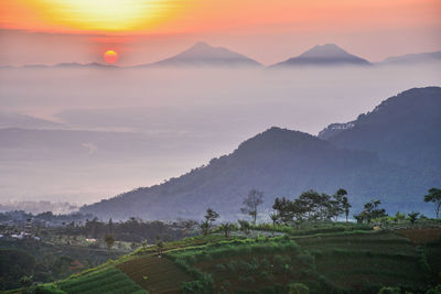 Scenic view of mountains against sky during sunset