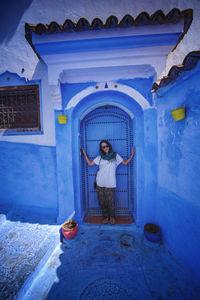 Man standing at entrance of building