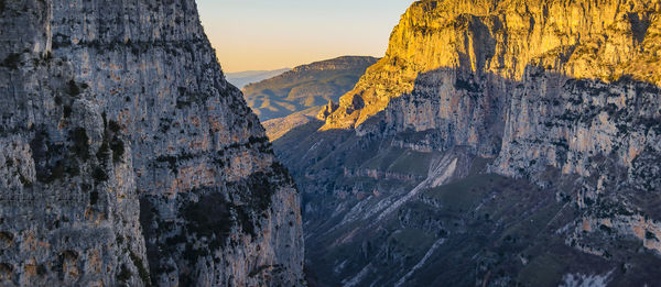 Scenic view of mountains against sky during sunset