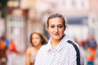 Portrait of smiling woman standing outdoors