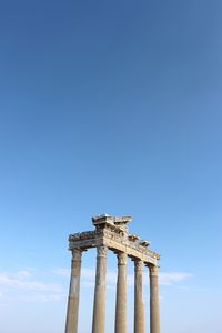 Low angle view of historical building against blue sky