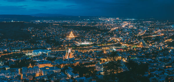 High angle view of illuminated city at night