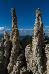 Scenic view of rock formation against blue sky