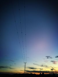 Low angle view of electricity pylon against sky