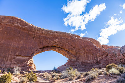 Low angle view of rock formations against sky