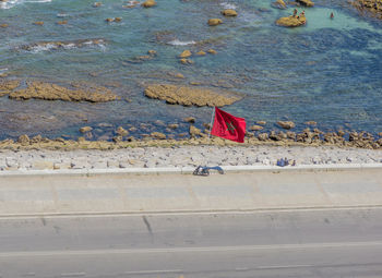 High angle view of flag on beach