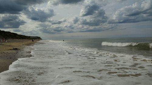 Scenic view of beach against sky