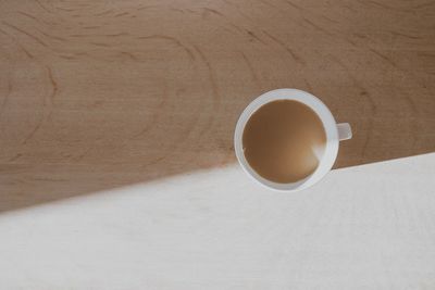 Directly above shot of coffee cup on table