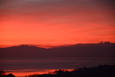 Scenic view of mountains against sky at sunset