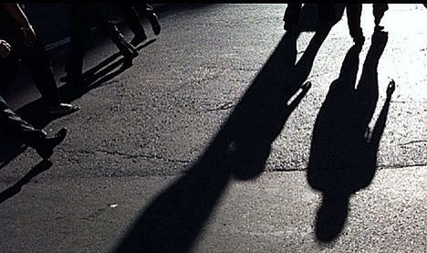 Low section of woman standing on tiled floor