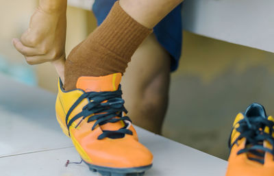 Low section of man standing on floor