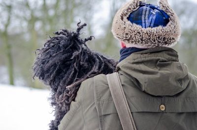 Rear view of woman in snow