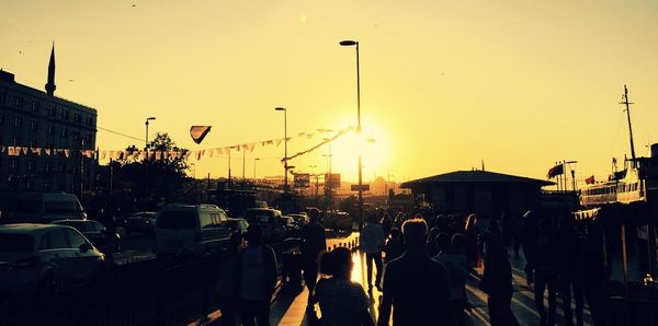 Panoramic view of silhouette city against sky during sunset