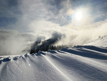 Scenic view of snow covered mountain against sky