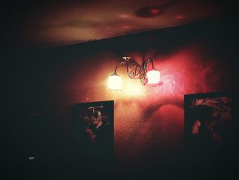 Low angle view of lit lamp