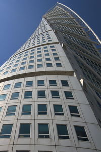 Low angle view of skyscraper against clear sky