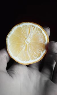 Close-up of hand holding apple