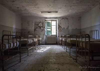 Empty chairs in abandoned building