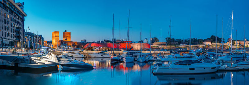 Boats moored at harbor