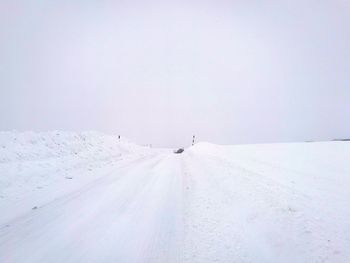 Scenic view of snow covered landscape against sky