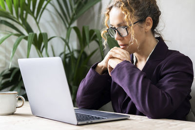 Young man using laptop at office