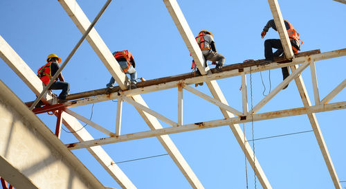 Low angle view of construction site against clear sky