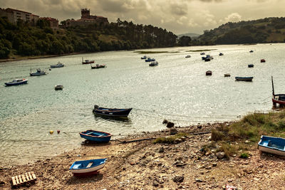 High angle view of boats moored on beach against sky