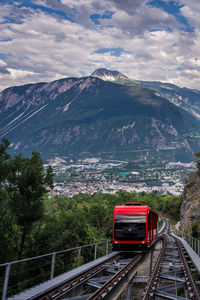 Railroad tracks against mountain