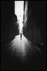 Alley amidst buildings in city