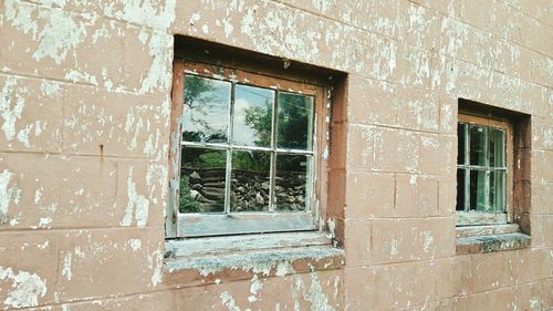 Close-up of window of abandoned house