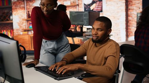 Man using laptop at gym