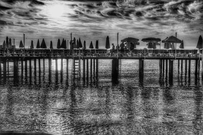 View of river in front of sea against sky