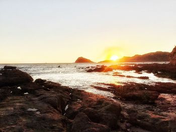 Scenic view of sea against sky at sunset