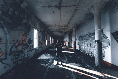 People walking in abandoned building