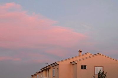 Low angle view of building against sky during sunset