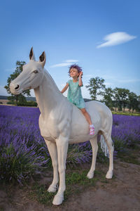 Horse standing against sky