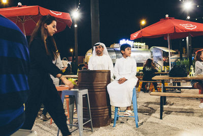 People standing at night