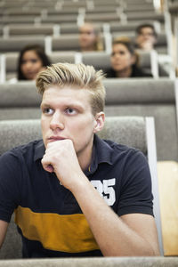 Close up of handsome young man concentrating on seminar