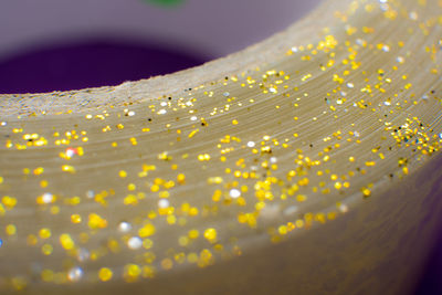 Close-up of glitters on book