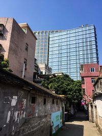 Low angle view of office building against sky