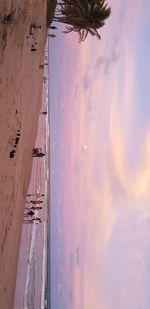 Panoramic view of beach against sky during sunset