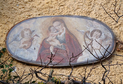 High angle view of carving on old wall