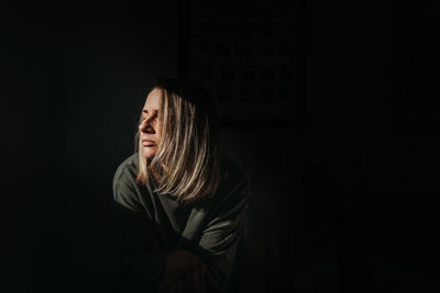 Man looking at camera over black background