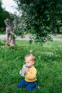 Cute baby girl on field