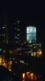 Illuminated buildings in city at night