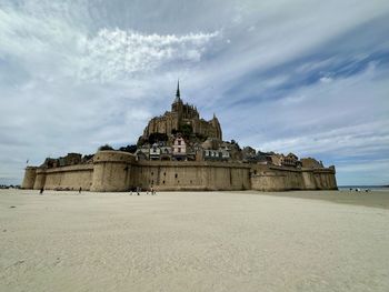 Low angle view of old ruins against sky