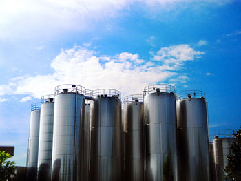Low angle view of smoke stack against sky