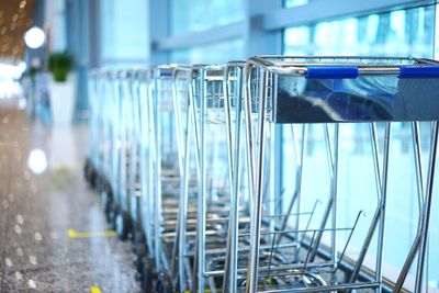 Trolleys in row by window